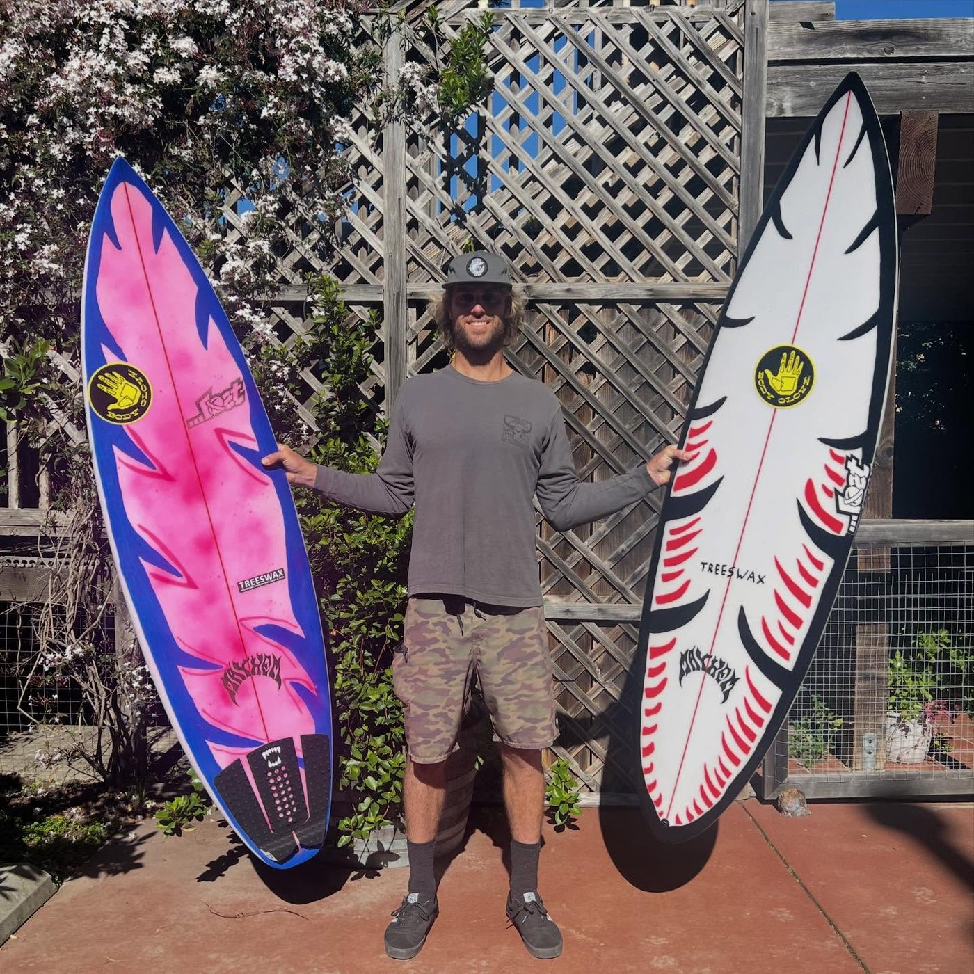 Dane Anderson with his surfboards at home in Santa Cruz